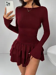 Elegant burgundy long sleeve mini dress with tiered ruffle skirt and slim fit design