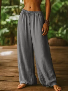 Detailed view of women's grey linen wide leg pants featuring an elastic drawstring waist