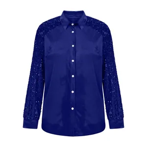Detailed view of the royal blue velvet shirt featuring elegant sequined sleeves.