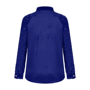 Back view of royal blue velvet shirt with shimmering sequined sleeves and cuffs.