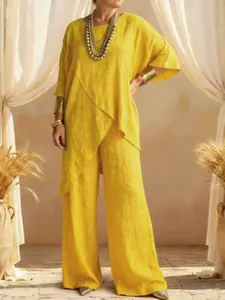 Women loose yellow cotton linen tunic and wide-leg pants two-piece set shown on model