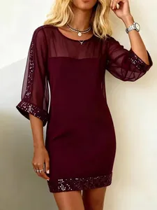 Elegant burgundy slim fit mesh dress featuring sparkling sequin trim on sleeves and hem