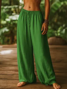 Detailed texture view of green cotton linen wide-leg pants with comfortable elastic waist