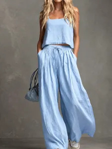 Casual light blue two-piece set featuring a loose tank top and wide-leg drawstring pants