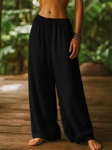 Close-up of black cotton linen wide leg pants featuring an elastic drawstring waist