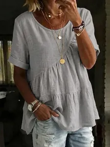 Close-up view of a women's casual gray cotton linen t-shirt featuring a tiered ruffled hem