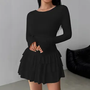Elegant black long sleeve slim-fit dress featuring a chic tiered ruffled skirt design