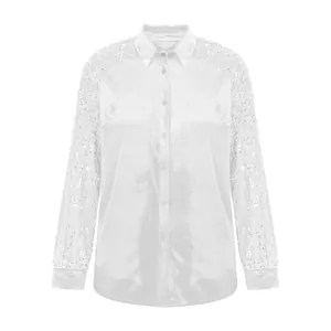Detailed front view of white velvet long-sleeve shirt with sparkling sequined sleeves