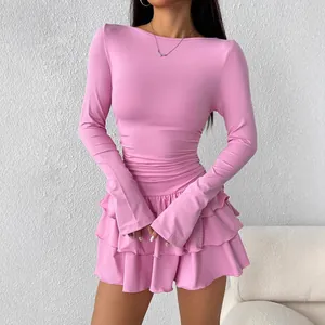 Slim fit pink long sleeve mini dress with ruffled layers and elegant design