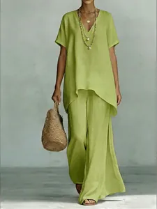 Detail of lime green V-neck tunic top and wide leg pants set with linen texture.