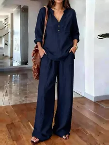 Elegant navy blue women's casual two-piece set with loose long sleeves and wide leg trousers
