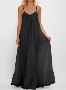 Full view of elegant black spaghetti strap maxi dress with ruffled hem and flowy silhouette