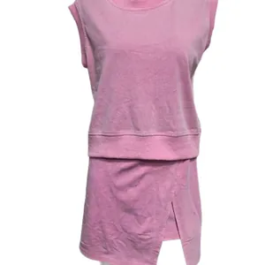Casual pink cotton two-piece set featuring a sleeveless sweatshirt top and matching mini skirt
