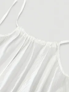 Elegant white pleated loose camisole dress with thin straps and gathered neckline detail
