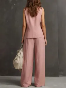 Rear view of a pink sleeveless cotton linen vest and wide-leg pants two-piece set