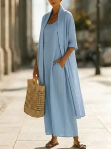 Fashionable street view of a light blue loose cotton linen two-piece maxi dress set.