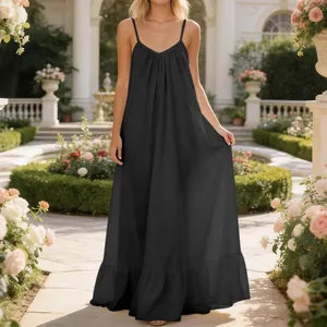 Elegant black sleeveless spaghetti strap maxi dress for women shown in a garden setting
