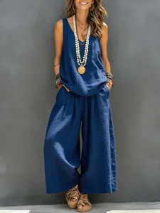 Full view of women's casual blue sleeveless top and matching wide-leg trousers set