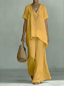 Stylish relaxed yellow linen set featuring a V-neck short-sleeve top and wide-leg pants