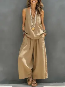 Detailed view of women's sleeveless khaki cotton linen top and wide-leg pants set