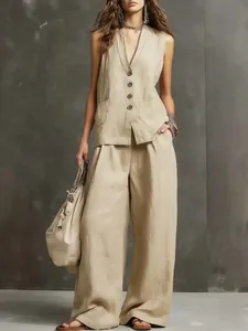 Full body detail of elegant beige linen sleeveless vest and wide-leg pants two-piece set