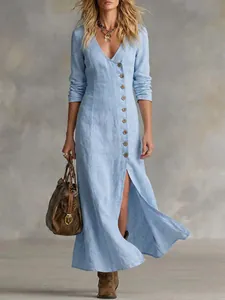 Light blue linen maxi dress with long sleeves, button front and elegant high side slit