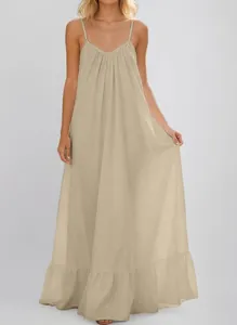Detailed view of a beige sleeveless spaghetti strap maxi dress for summer leisure