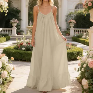 Elegant summer sleeveless spaghetti strap maxi dress displayed in a lush garden setting