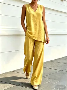 Stylish yellow cotton linen two-piece outfit featuring V-neck sleeveless top and wide-leg pants