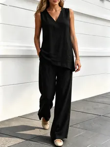 Detailed view of women's black V-neck sleeveless linen top and wide-leg pants set.