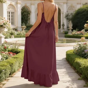 Detailed back view of a sexy backless spaghetti strap maxi dress featuring a ruffle hemline