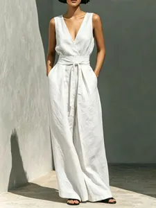 Elegant white linen-style two-piece set featuring sleeveless top and wide-leg trousers