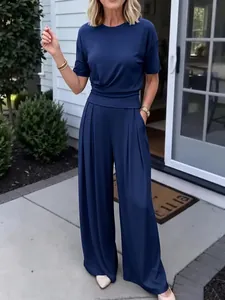 Detail view of navy blue two-piece set featuring short sleeve t-shirt and wide leg pants