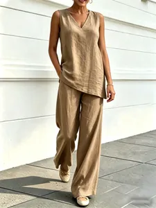 Full-body detail of women's khaki V-neck cotton linen top and wide-leg pants set
