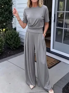 Women's casual grey two-piece set with a short-sleeved top and flowy wide-leg pants