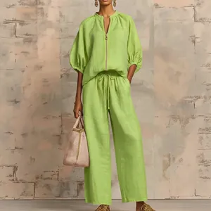Women's summer two-piece set featuring a lime green zipper blouse and wide-leg pants