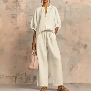 Casual white summer two-piece set featuring loose zipper top and wide-leg drawstring pants