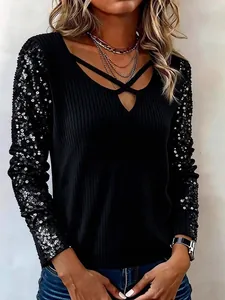 Elegante zwarte top met lange mouwen en V-hals met pailletten mouwen voor dames