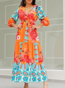 Detailed view of bohemian printed V-neck maxi dress with tiered skirt design