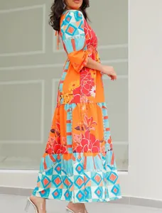 Side profile of a vintage ethnic print maxi dress with colorful floral and geometric patterns.