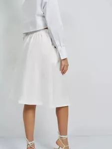 Back view of a white A-line midi skirt with elastic waist and side pockets