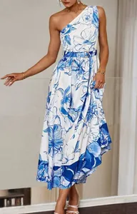 Detail of one-shoulder maxi dress featuring elegant blue and white floral print pattern