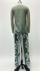 Back view of a casual sleeveless sage green top and leaf print wide-leg pants set