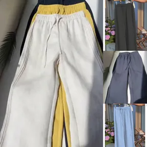 Detailed close-up showing casual wide-leg drawstring trousers in various vibrant summer colors.