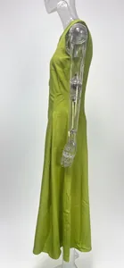 Side view of a lime green high-waist sleeveless maxi dress displayed on a mannequin