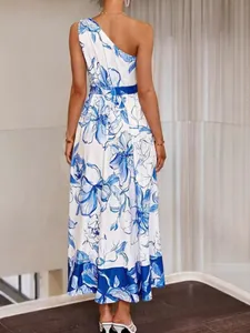 Elegant one-shoulder blue and white floral maxi dress for a summer beach vacation