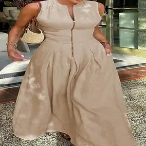 Detail shot of a beige sleeveless high-waisted maxi dress with a front zipper closure