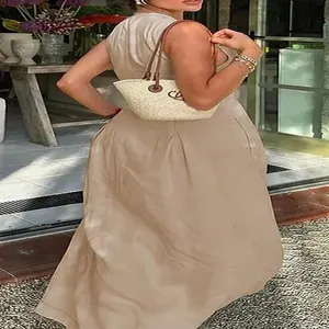 Back view of an elegant woman in a khaki sleeveless high-waist maxi dress for summer