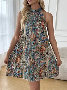 Vibrant paisley print halter neck sleeveless bohemian mini dress for a beach holiday