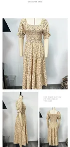 Gelbes Blumen-Midi-Kleid mit gesmokter Taille und Puffärmeln in der Detailansicht.